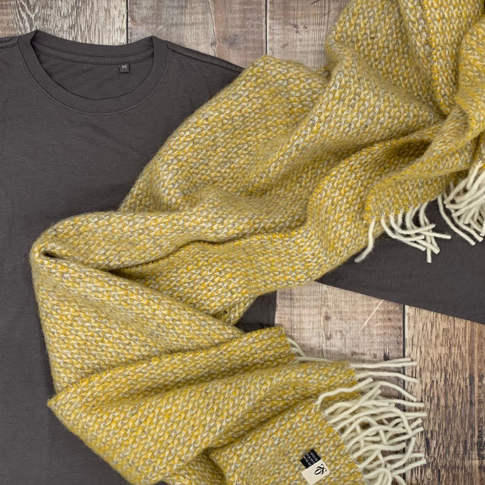 Yellow and grey blanket with an OSS tee