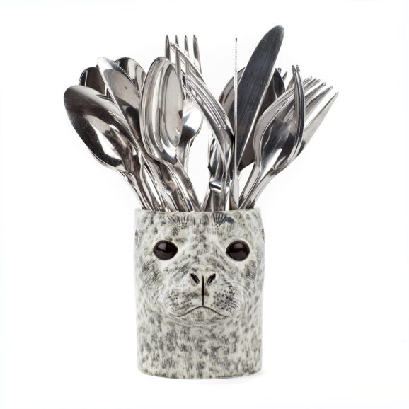 front view of a seal head pot holding cutlery
