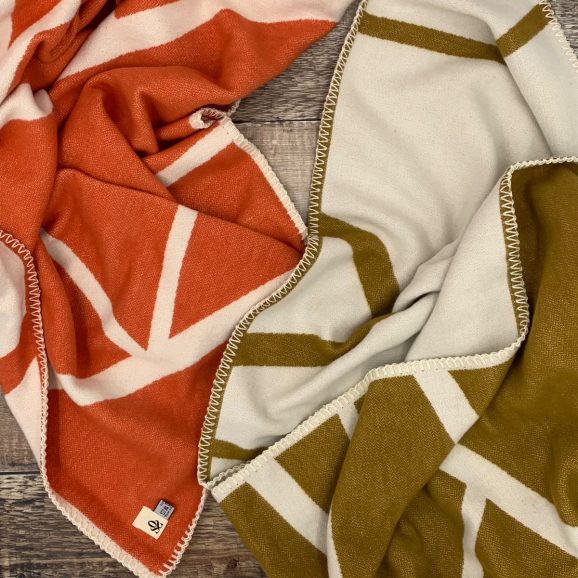 orange and brown blankets with twig pattern
