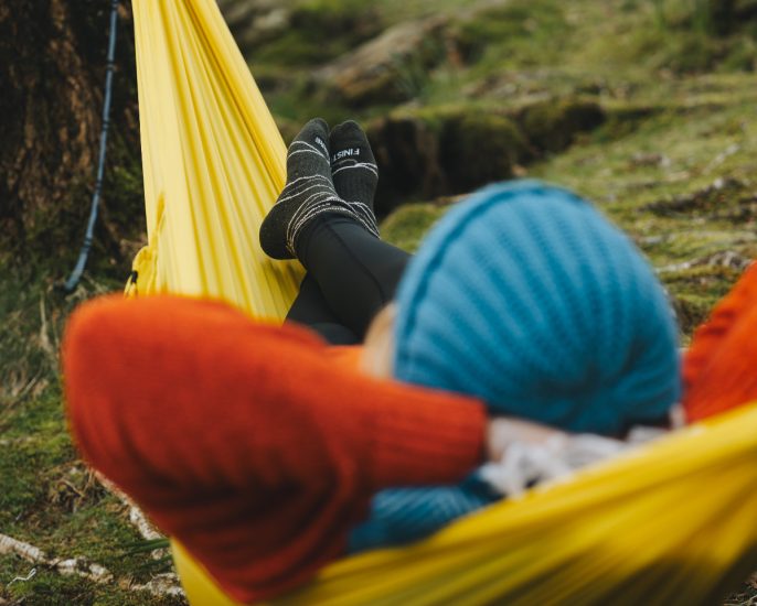 lying out in sunshine yellow hammock