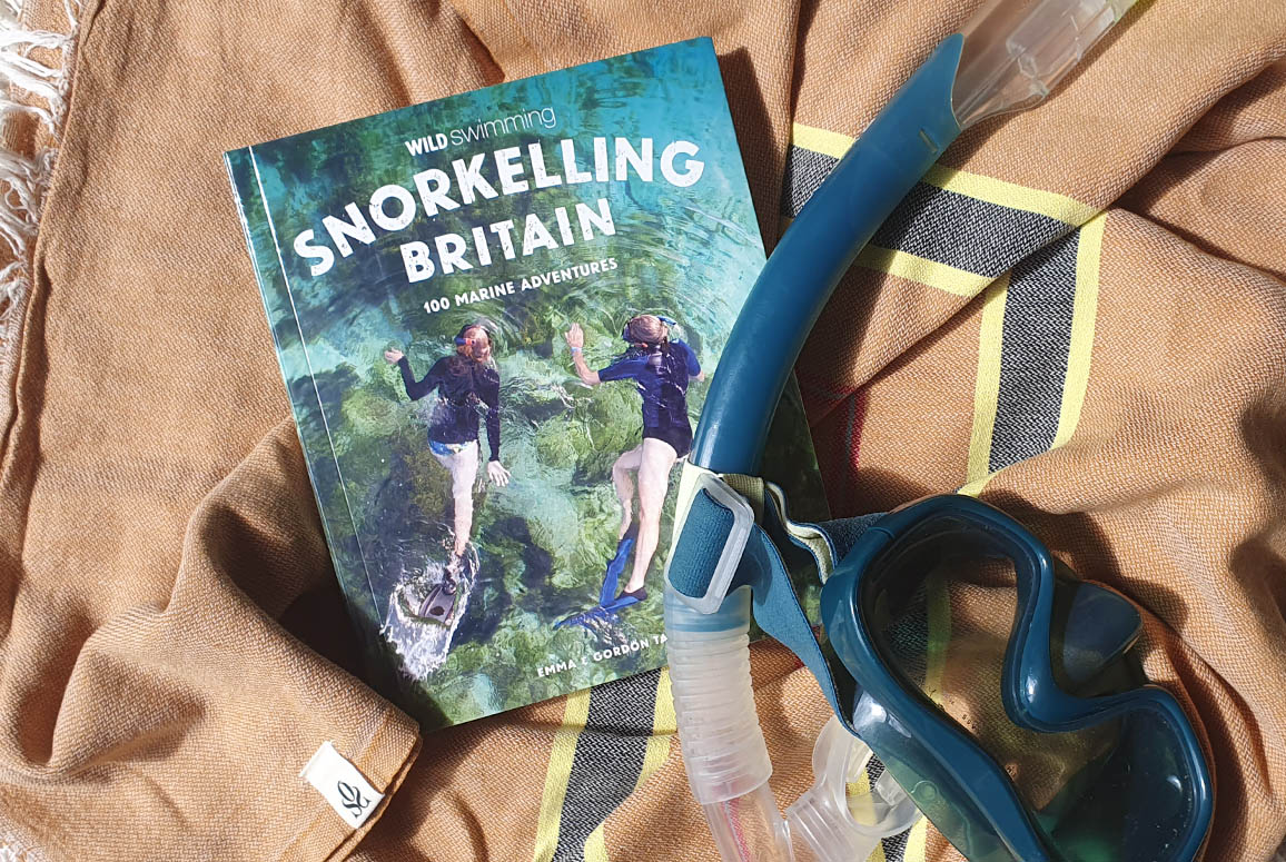 Snorkelling Britain book on an OSS hammam next to a snorkel and mask