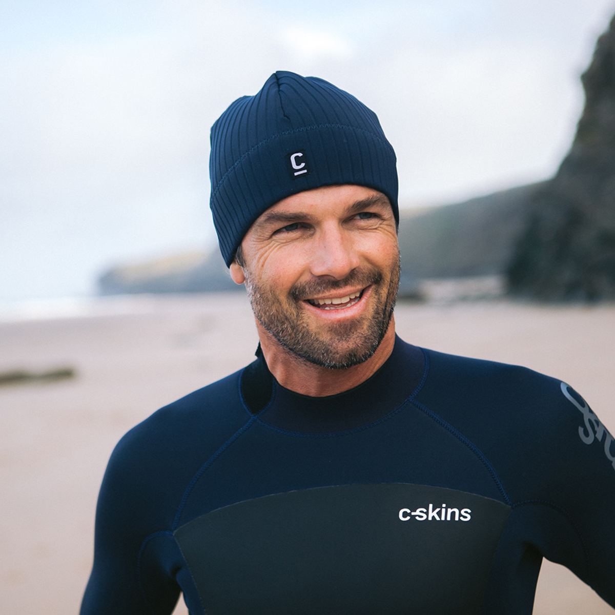 CJB Surf/C-Skins Man wearing a storm chaser beanie in navy