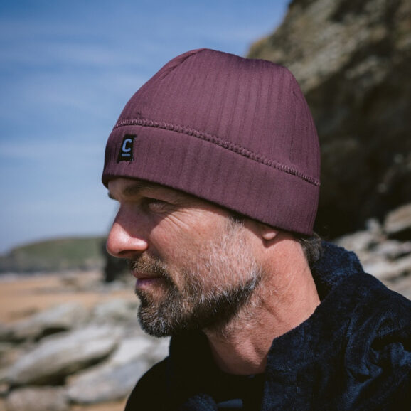 Man wearing a storm chaser beanie in rust